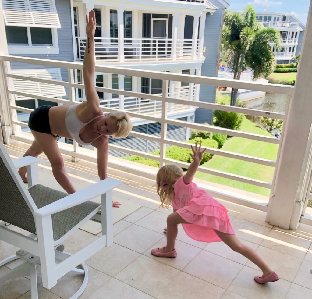 mother and daughter doing yoga