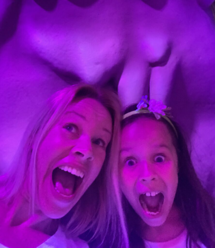 Mother and daughter sharing a playful moment, representing inherited traits and connection.