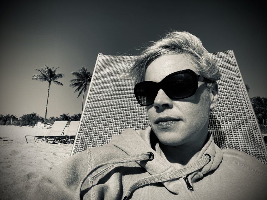 Woman quietly reflecting, symbolizing self-discovery and awareness.